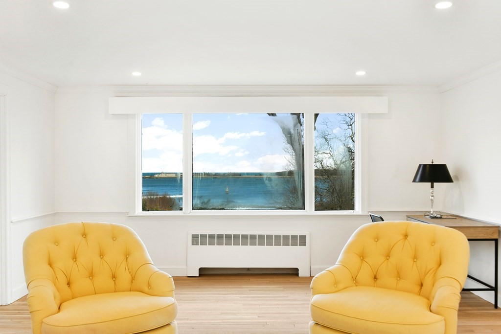 15 White Head Road Cohasset, MA 02025 - Photo 14 of 19 a living room with a couch and a large window