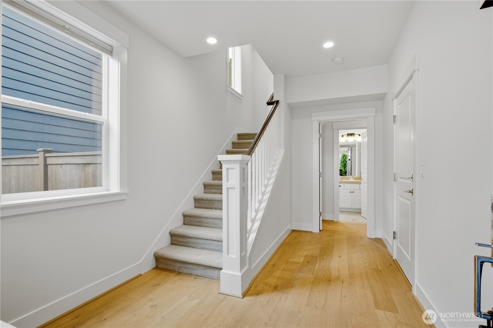 18615 46th Avenue Southeast Bothell, WA 98012 - Photo 2 of 37 a view of a hallway with wooden floor and entryway