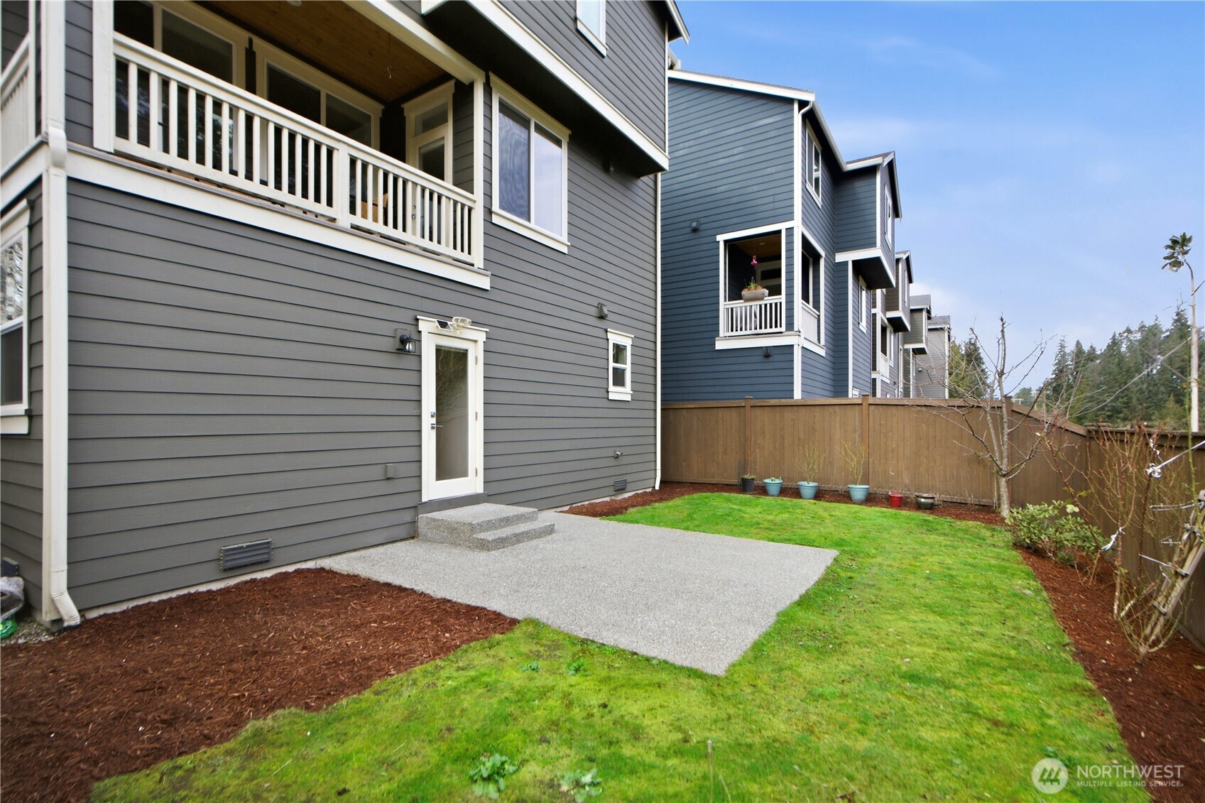 18615 46th Avenue Southeast Bothell, WA 98012 - Photo 35 of 37 a view of a house with brick walls and a yard with trees