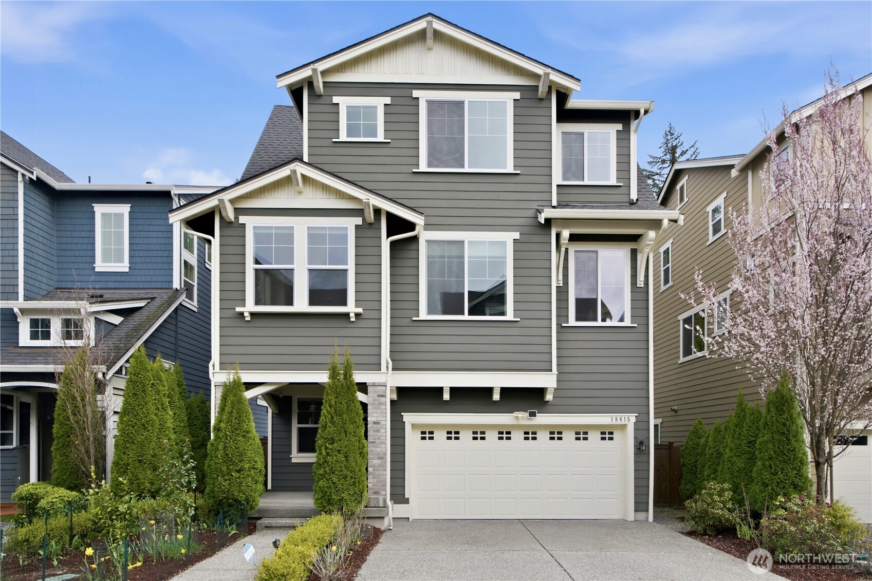 18615 46th Avenue Southeast Bothell, WA 98012 - Photo 37 of 37 a view of a house with a yard and potted plants