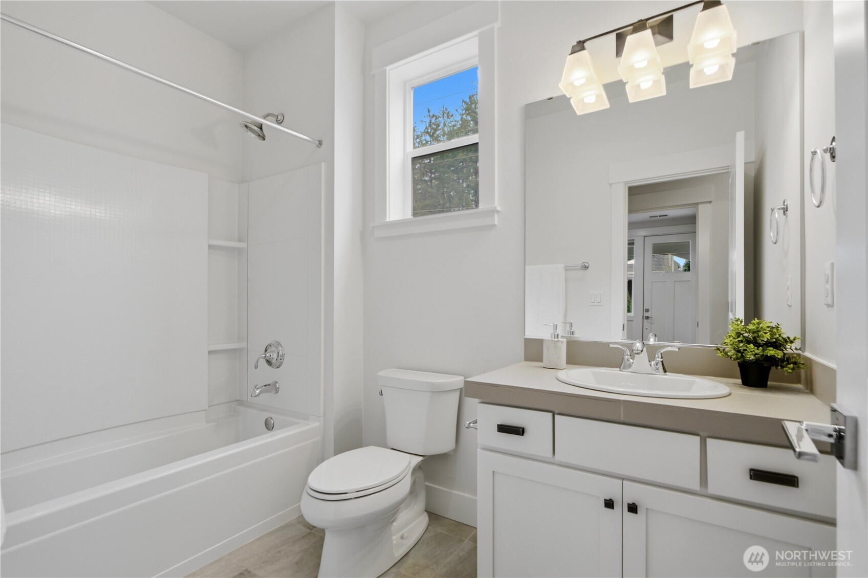 18615 46th Avenue Southeast Bothell, WA 98012 - Photo 4 of 37 a bathroom with a sink a toilet and a bathtub