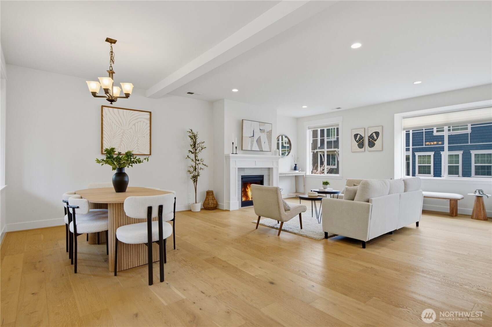 18615 46th Avenue Southeast Bothell, WA 98012 - Photo 5 of 37 a living room with furniture a fireplace and a chandelier