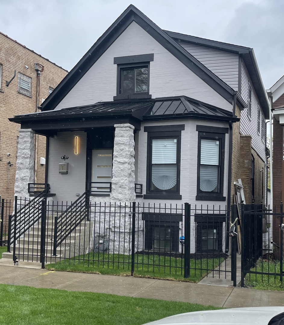 6637 South Marquette Road Chicago, IL 60637 - Photo 1 of 22 a front view of a house with garden