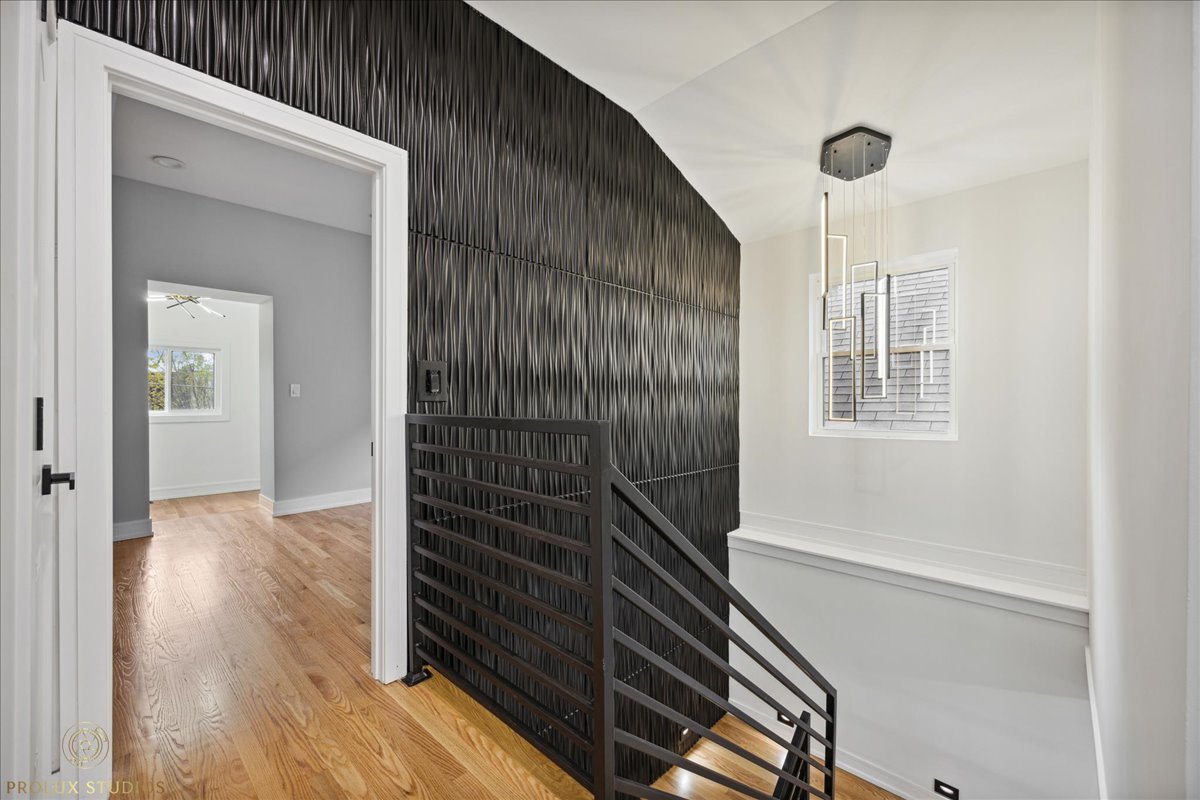 6637 South Marquette Road Chicago, IL 60637 - Photo 12 of 22 a view of an empty room with wooden floor and a window