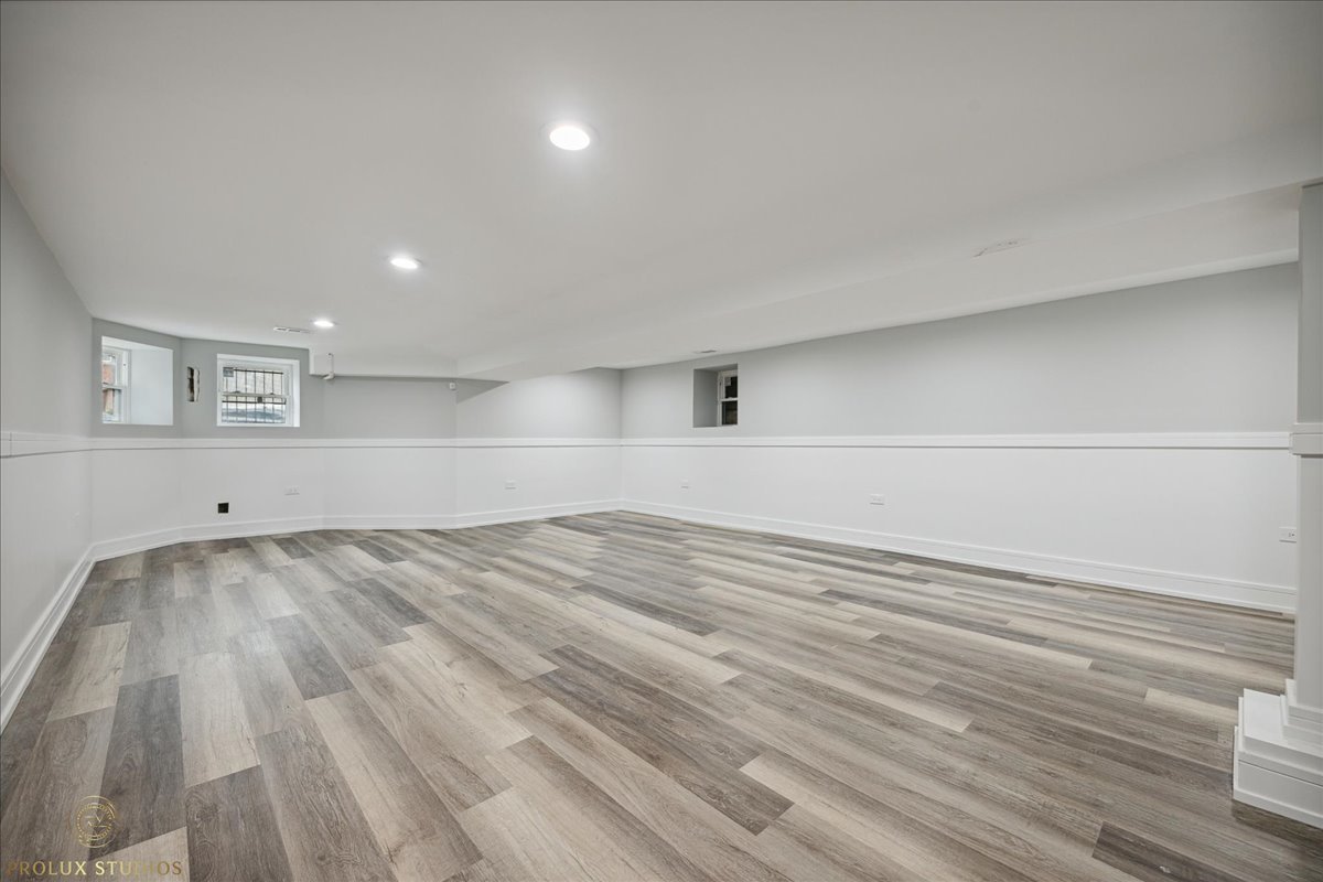 6637 South Marquette Road Chicago, IL 60637 - Photo 17 of 22 a view of empty room with wooden floor