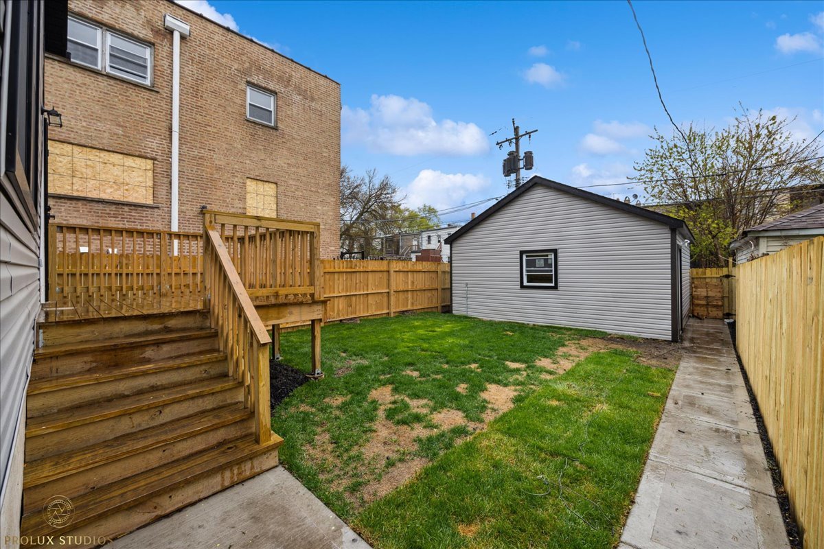 6637 South Marquette Road Chicago, IL 60637 - Photo 22 of 22 a view of a house with a yard