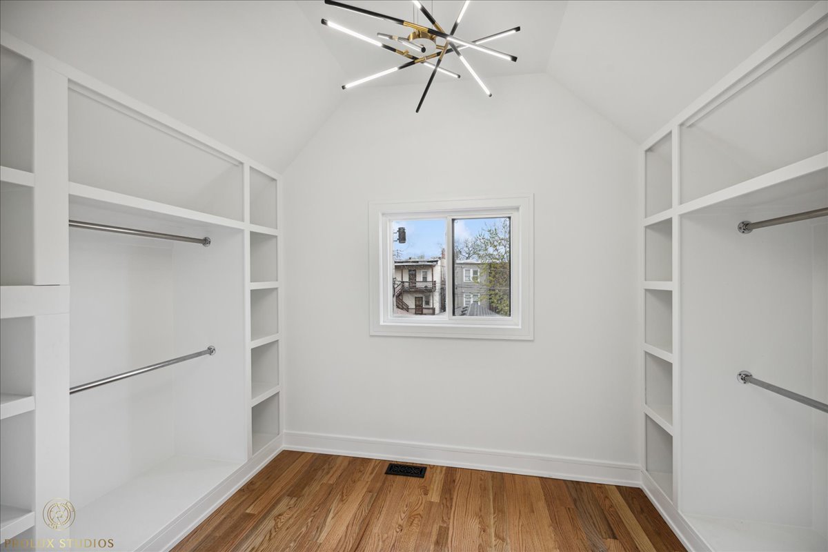 6637 South Marquette Road Chicago, IL 60637 - Photo 8 of 22 a view of an empty room with wooden floor and a window