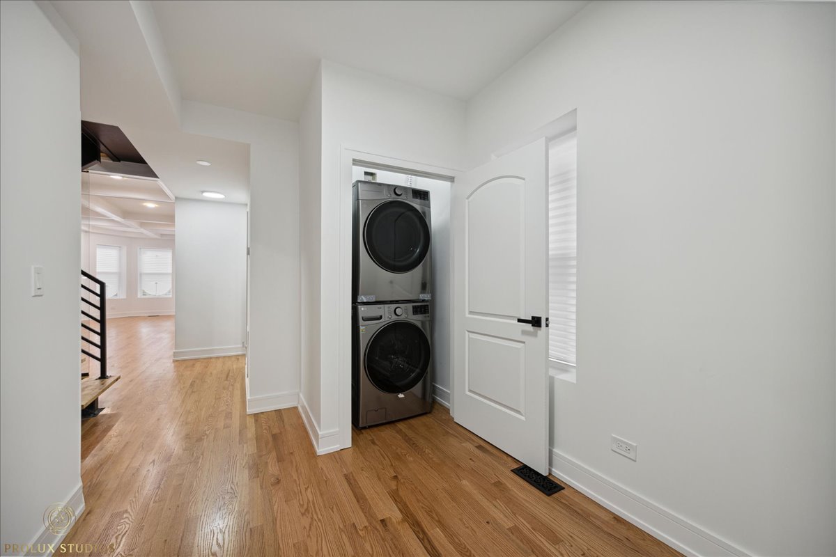 6637 South Marquette Road Chicago, IL 60637 - Photo 10 of 22 a view of a hallway with washer and dryer