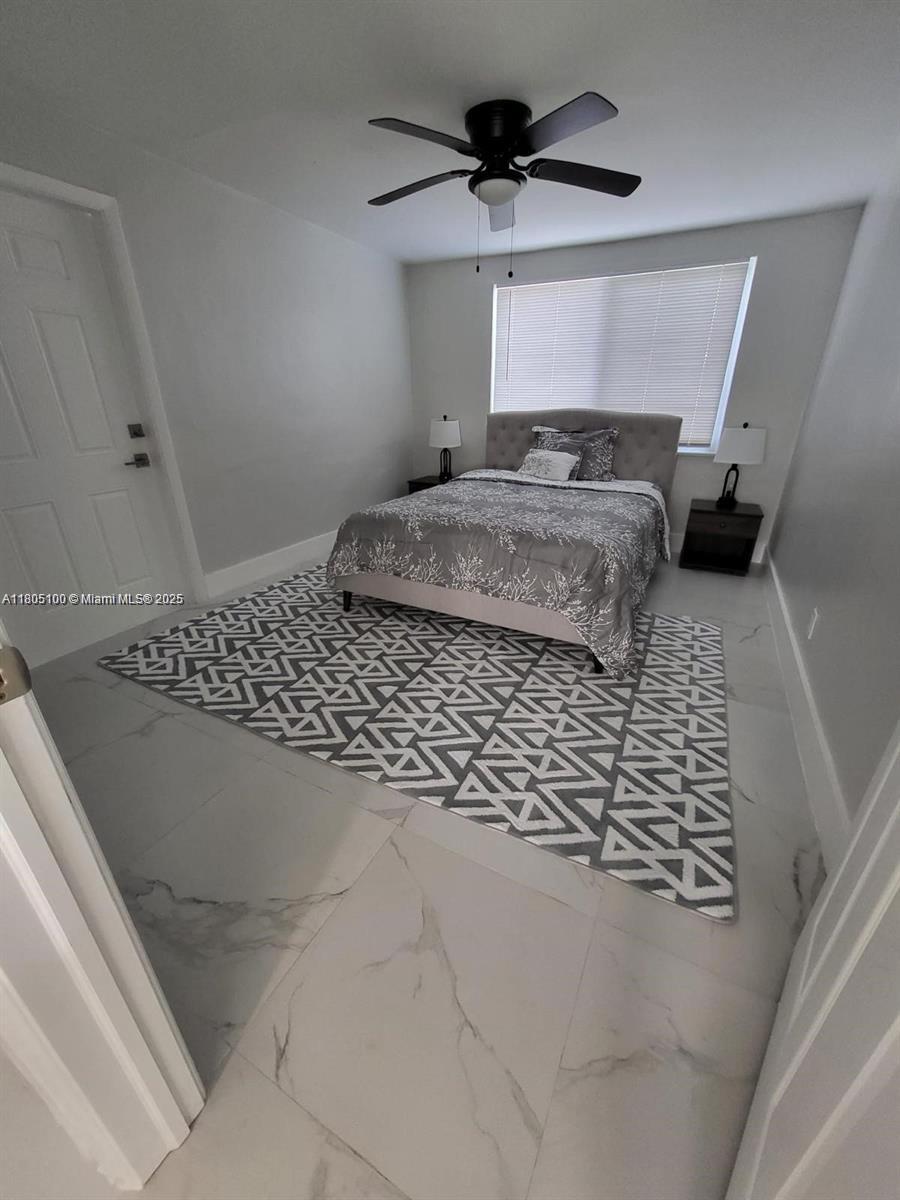 900 Southwest 31st Street Fort Lauderdale, FL 33315 - Photo 12 of 14 a bedroom with a bed and a window