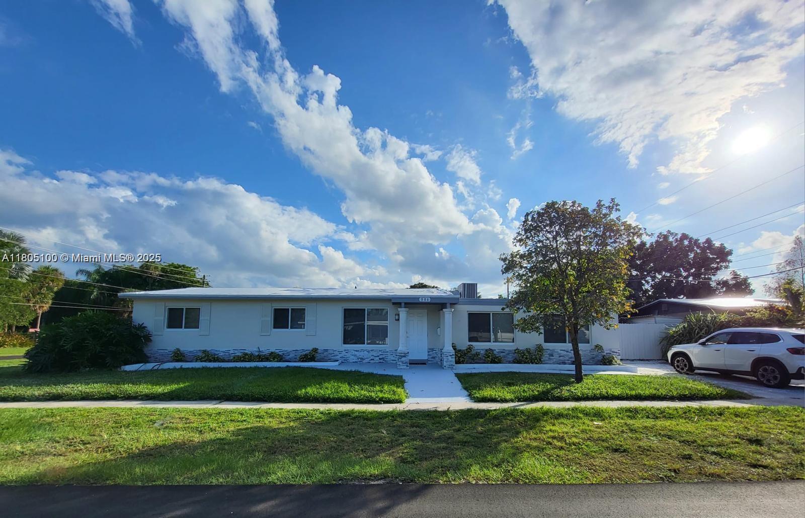 900 Southwest 31st Street Fort Lauderdale, FL 33315 - Photo 13 of 14 a front view of a house with a garden