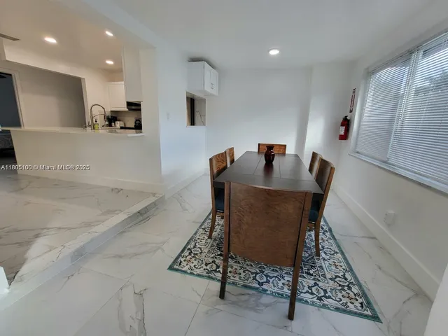 a dining room with furniture and a table
