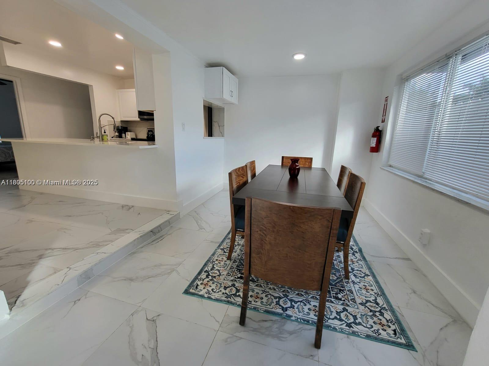900 Southwest 31st Street Fort Lauderdale, FL 33315 - Photo 2 of 14 a dining room with furniture and a table