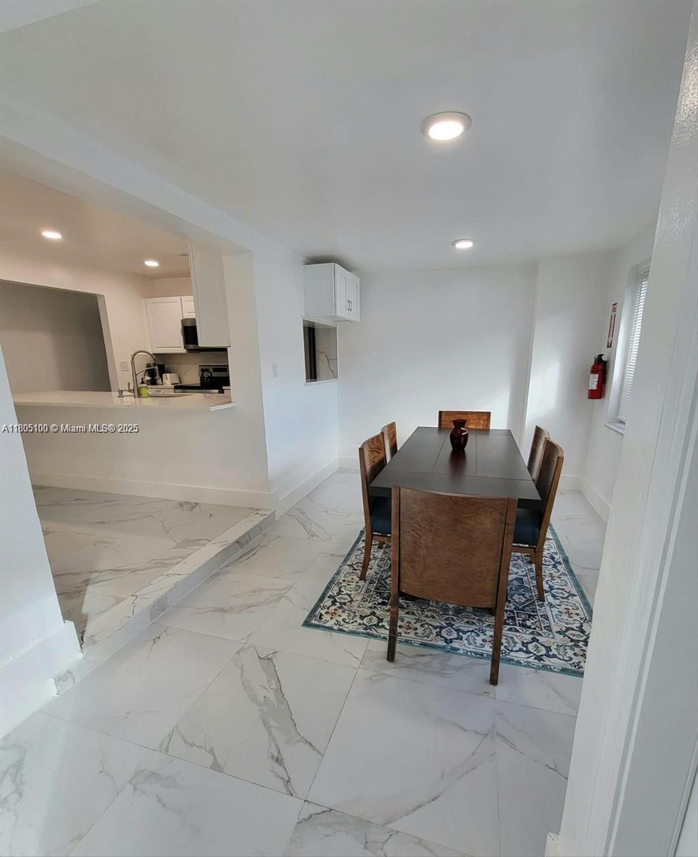 900 Southwest 31st Street Fort Lauderdale, FL 33315 - Photo 3 of 14 a living room with furniture and a table