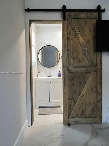 a bathroom with a sink a toilet and a shower