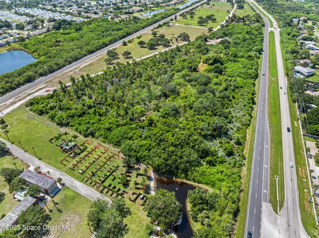 an aerial view of a yard with a lake view
