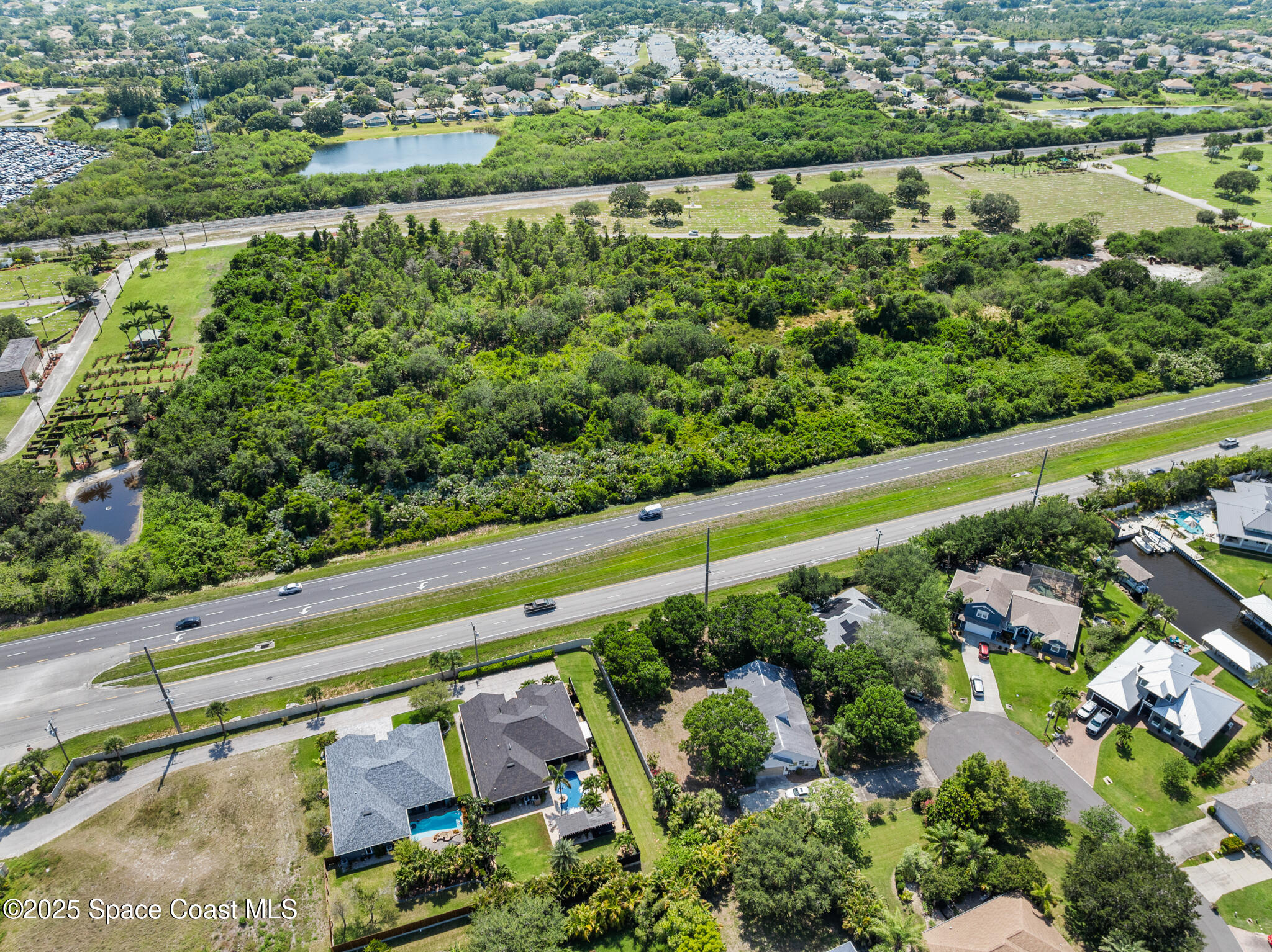 0 Us-1 Rockledge, FL 32955 - Photo 10 of 13 an aerial view of a yard with a lake view