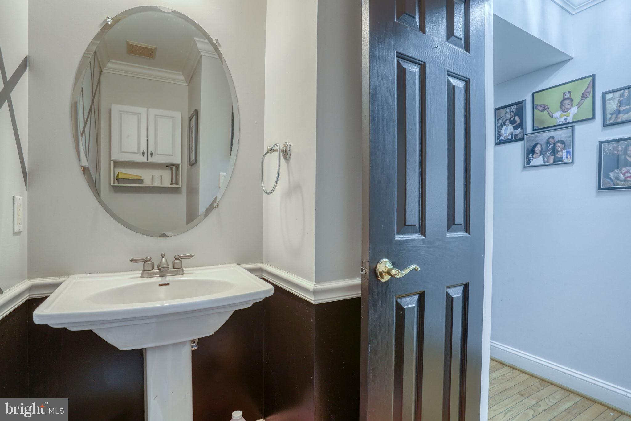 12 Bancroft Road New Castle, DE 19720 - Photo 21 of 38 a bathroom with a sink and a mirror