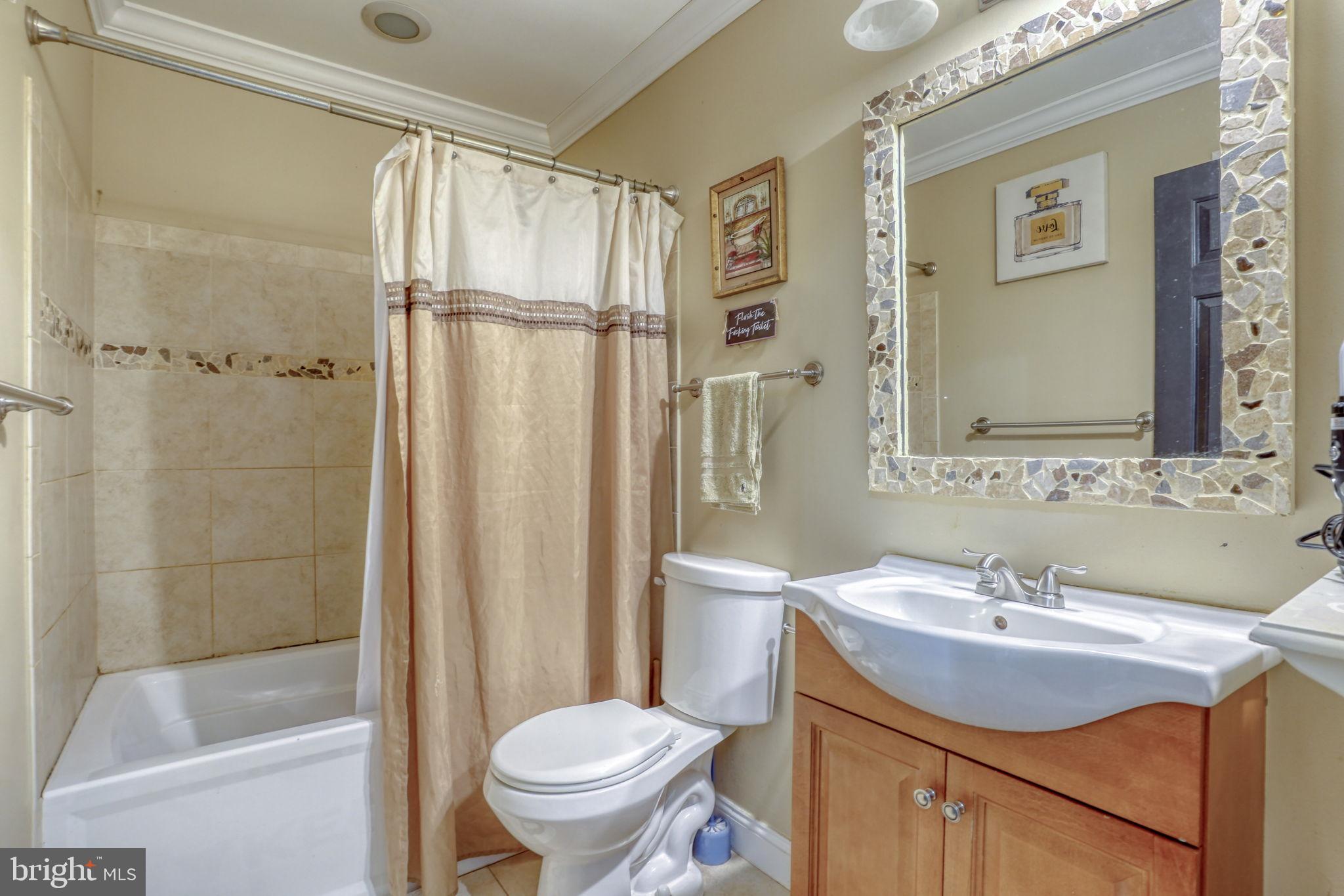 12 Bancroft Road New Castle, DE 19720 - Photo 30 of 38 a bathroom with a sink toilet and shower