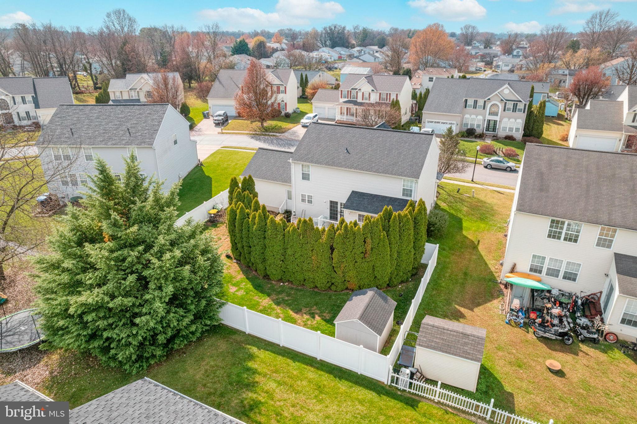 12 Bancroft Road New Castle, DE 19720 - Photo 3 of 38 an aerial view of a house with swimming pool and large trees