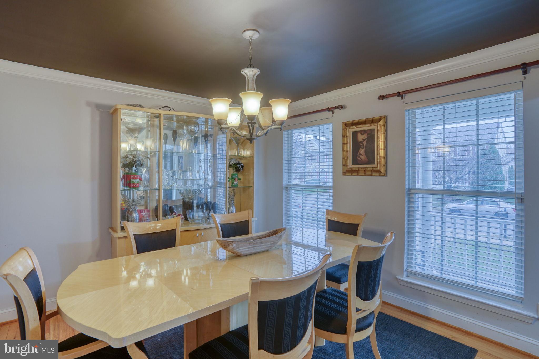 12 Bancroft Road New Castle, DE 19720 - Photo 8 of 38 a view of a dining room with furniture and wooden floor