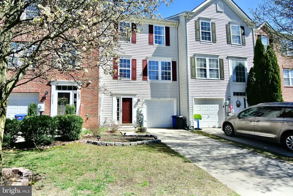 a view of multiple house with yard