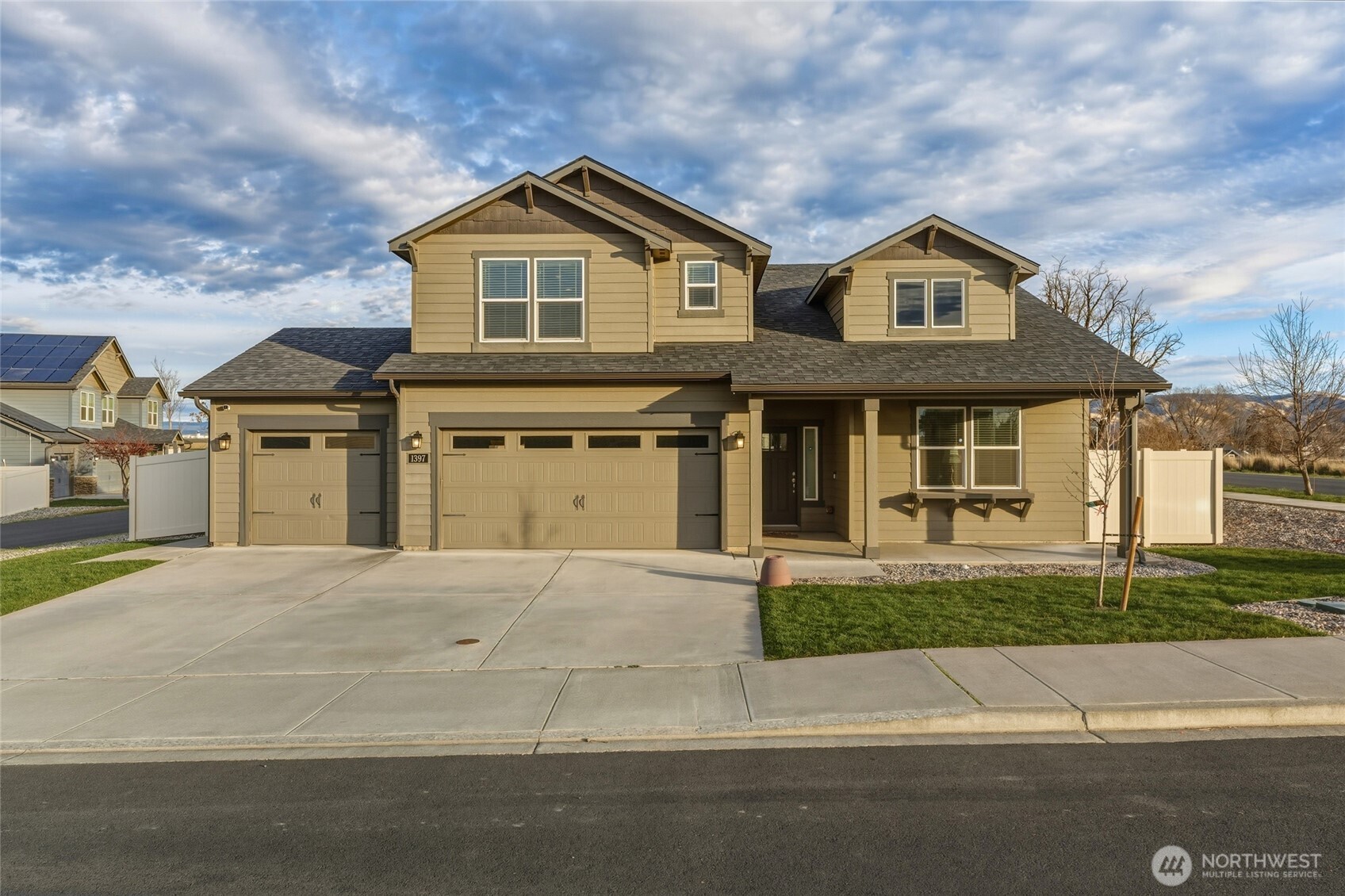 1397 Caprio Loop Walla Walla, WA 99362 - Photo 1 of 40 a front view of a house with a yard and garage