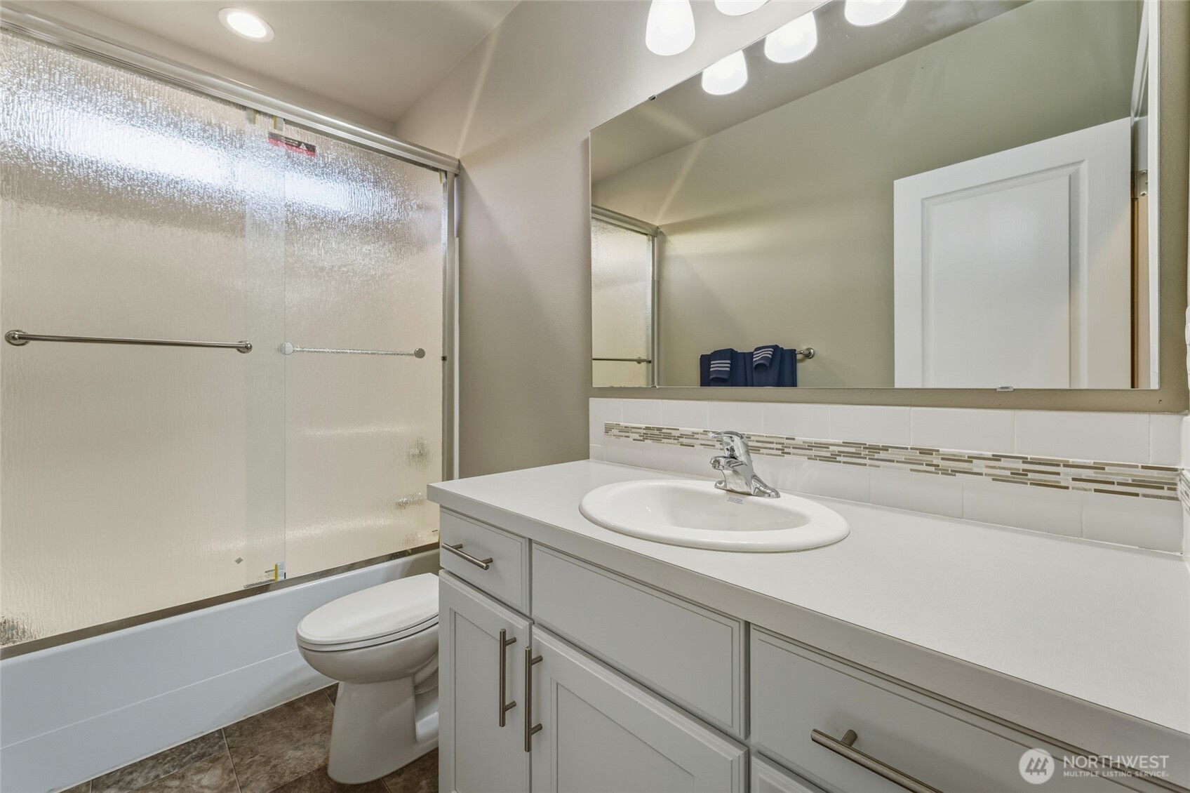 1397 Caprio Loop Walla Walla, WA 99362 - Photo 13 of 40 a bathroom with a sink and a mirror