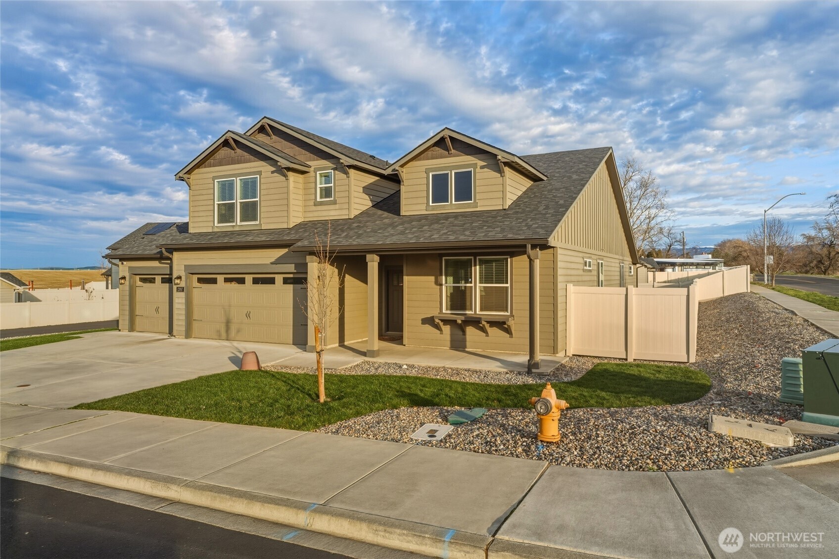 1397 Caprio Loop Walla Walla, WA 99362 - Photo 2 of 40 a front view of a house with a yard and garage