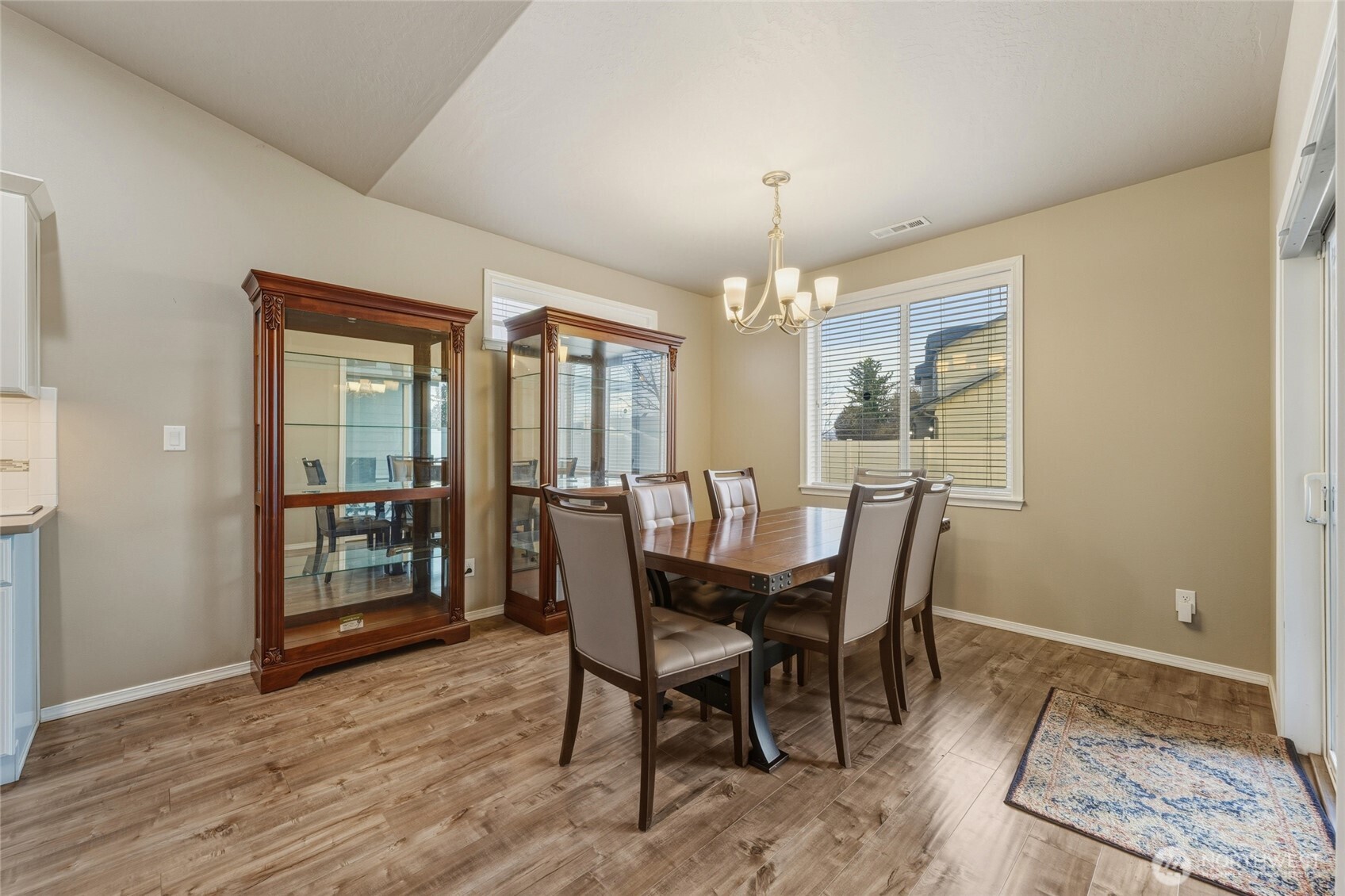 1397 Caprio Loop Walla Walla, WA 99362 - Photo 22 of 40 a view of a dining room with furniture window and wooden floor