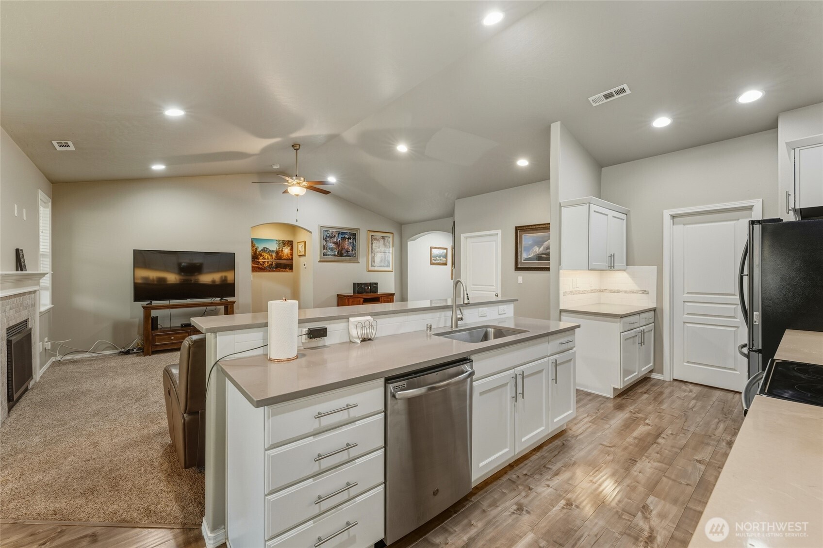 1397 Caprio Loop Walla Walla, WA 99362 - Photo 26 of 40 a kitchen with a sink stainless steel appliances and cabinets