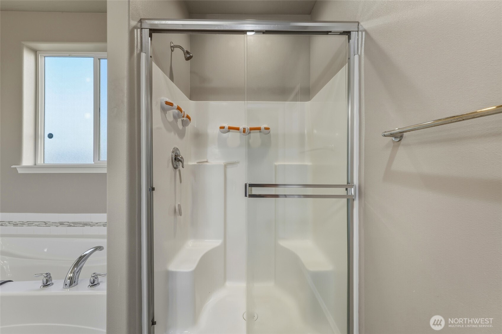 1397 Caprio Loop Walla Walla, WA 99362 - Photo 33 of 40 a bathroom with a glass shower door and a bath tub