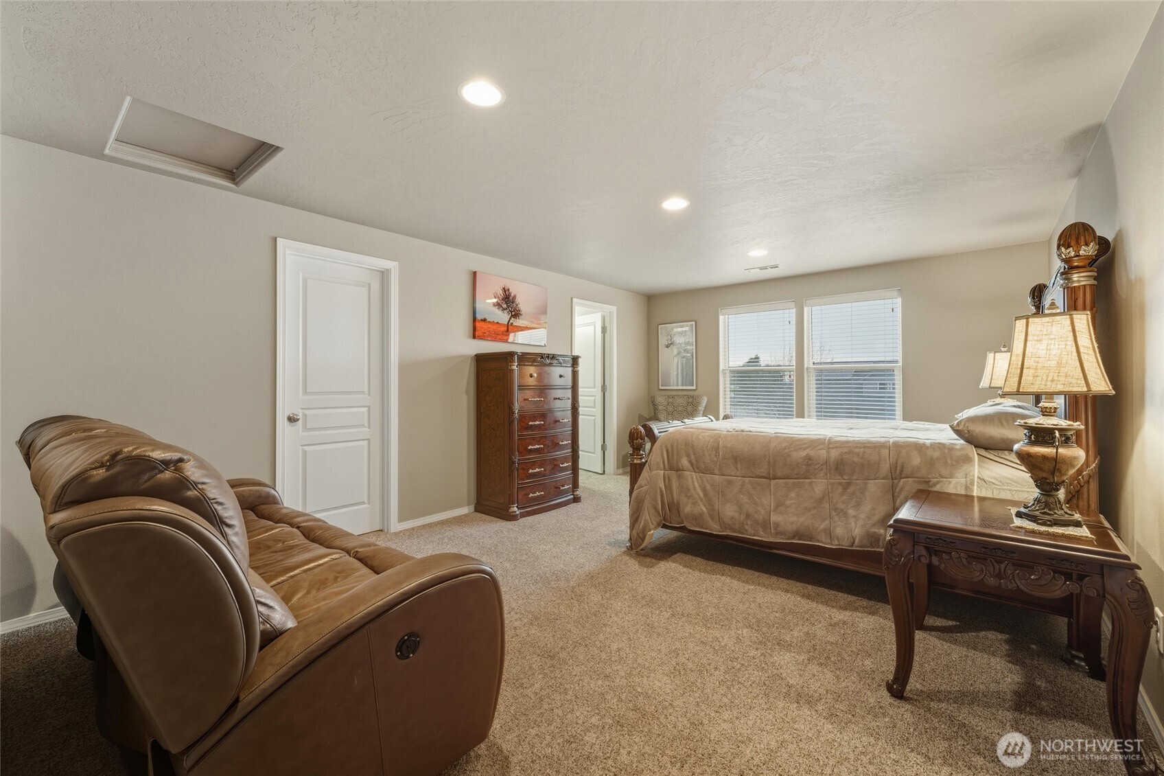 1397 Caprio Loop Walla Walla, WA 99362 - Photo 36 of 40 a bedroom with a bed and a couch