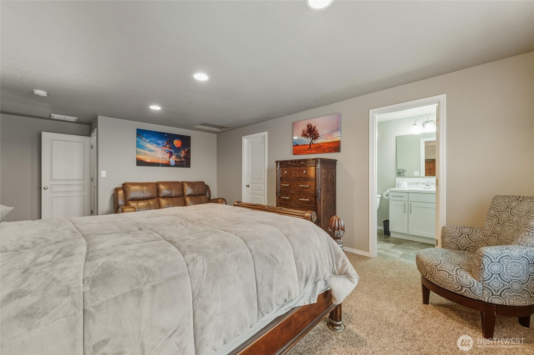 1397 Caprio Loop Walla Walla, WA 99362 - Photo 39 of 40 a spacious bedroom with a bed and glass windows