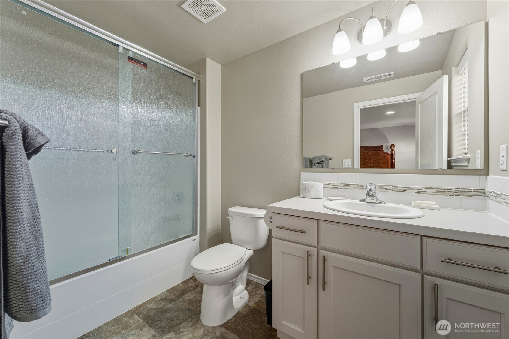 1397 Caprio Loop Walla Walla, WA 99362 - Photo 40 of 40 a bathroom with a toilet sink and mirror