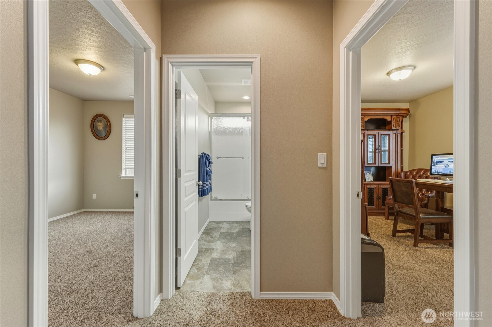 1397 Caprio Loop Walla Walla, WA 99362 - Photo 10 of 40 a view of a hallway with a livingroom and dining room and chandelier