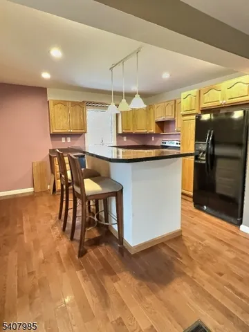 a kitchen with stainless steel appliances granite countertop a sink counter space and cabinets