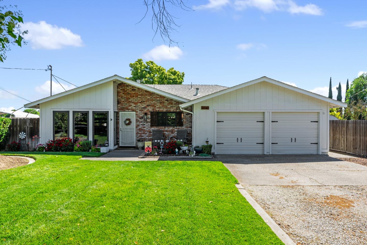 15940 South Austin Road Manteca, CA 95336 - Photo 1 of 1 a view of a house with a yard and sitting area