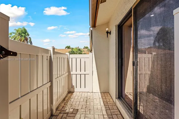 a view of a wooden door with a glass door