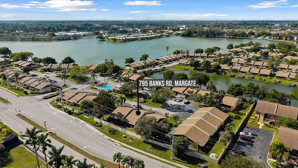 an aerial view of a city with lake view