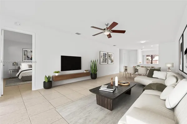 a living room with furniture and a flat screen tv