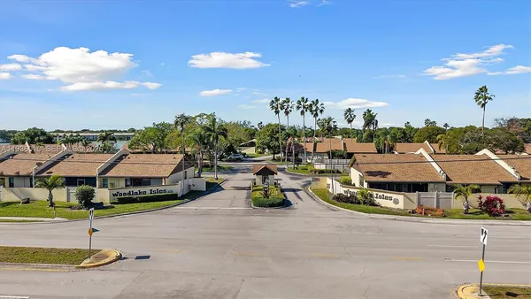 a view of multiple houses with a street