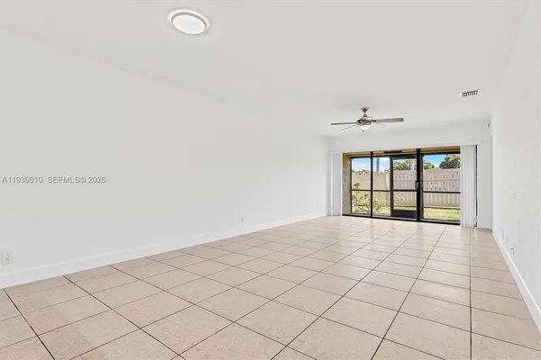 a view of an empty room and window