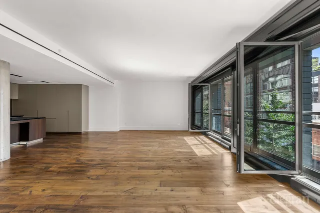 a black and white photo of a living room