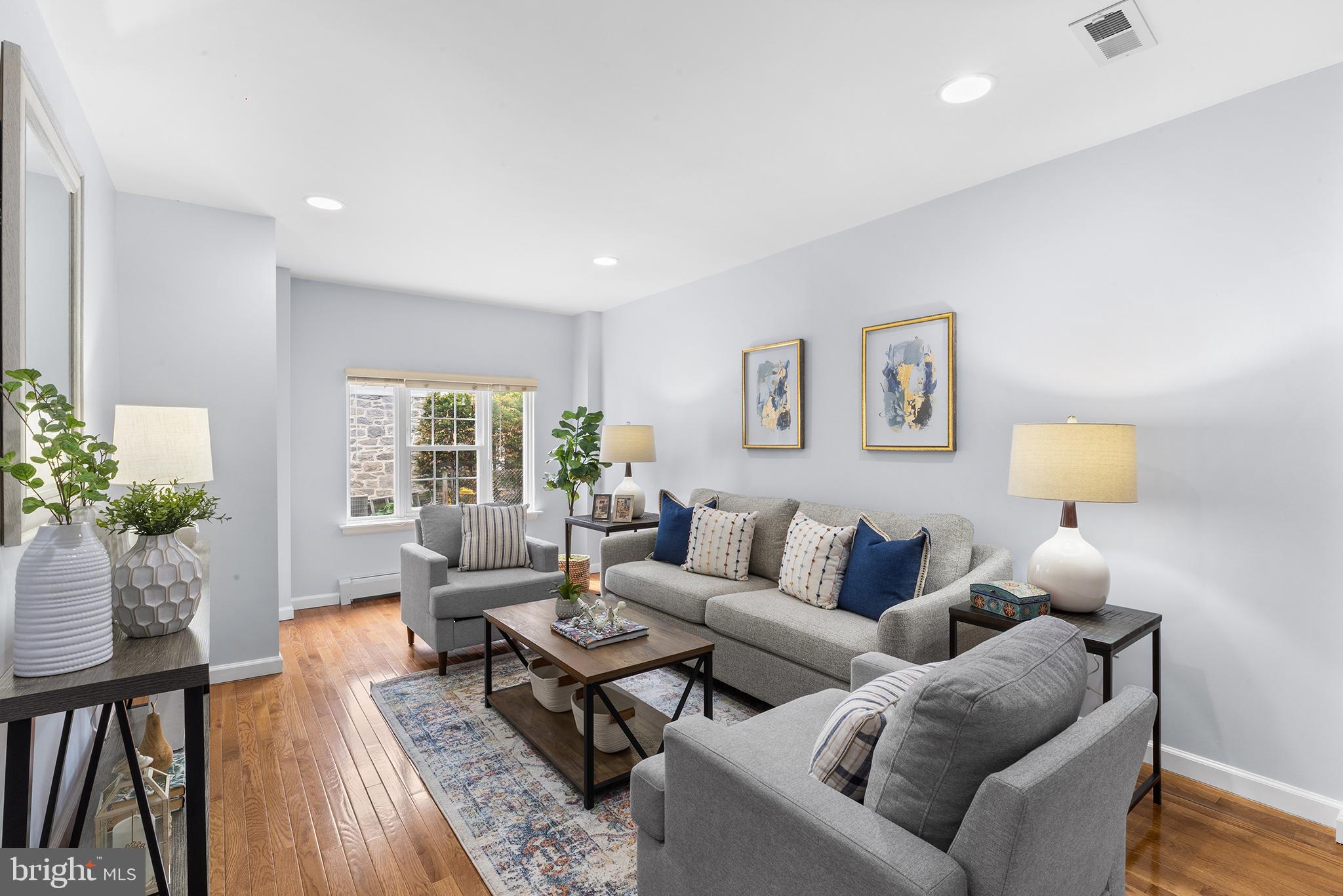 112 Rolling Road Bala Cynwyd, PA 19004 - Photo 14 of 39 a living room with furniture and a potted plant on table