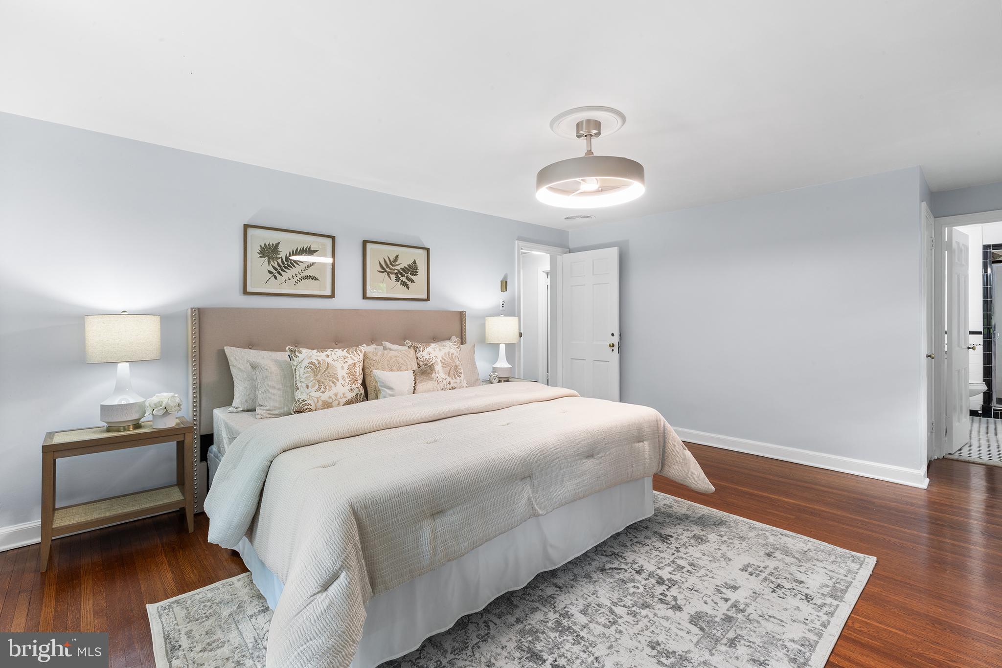 112 Rolling Road Bala Cynwyd, PA 19004 - Photo 17 of 39 a bedroom with a bed and wooden floor