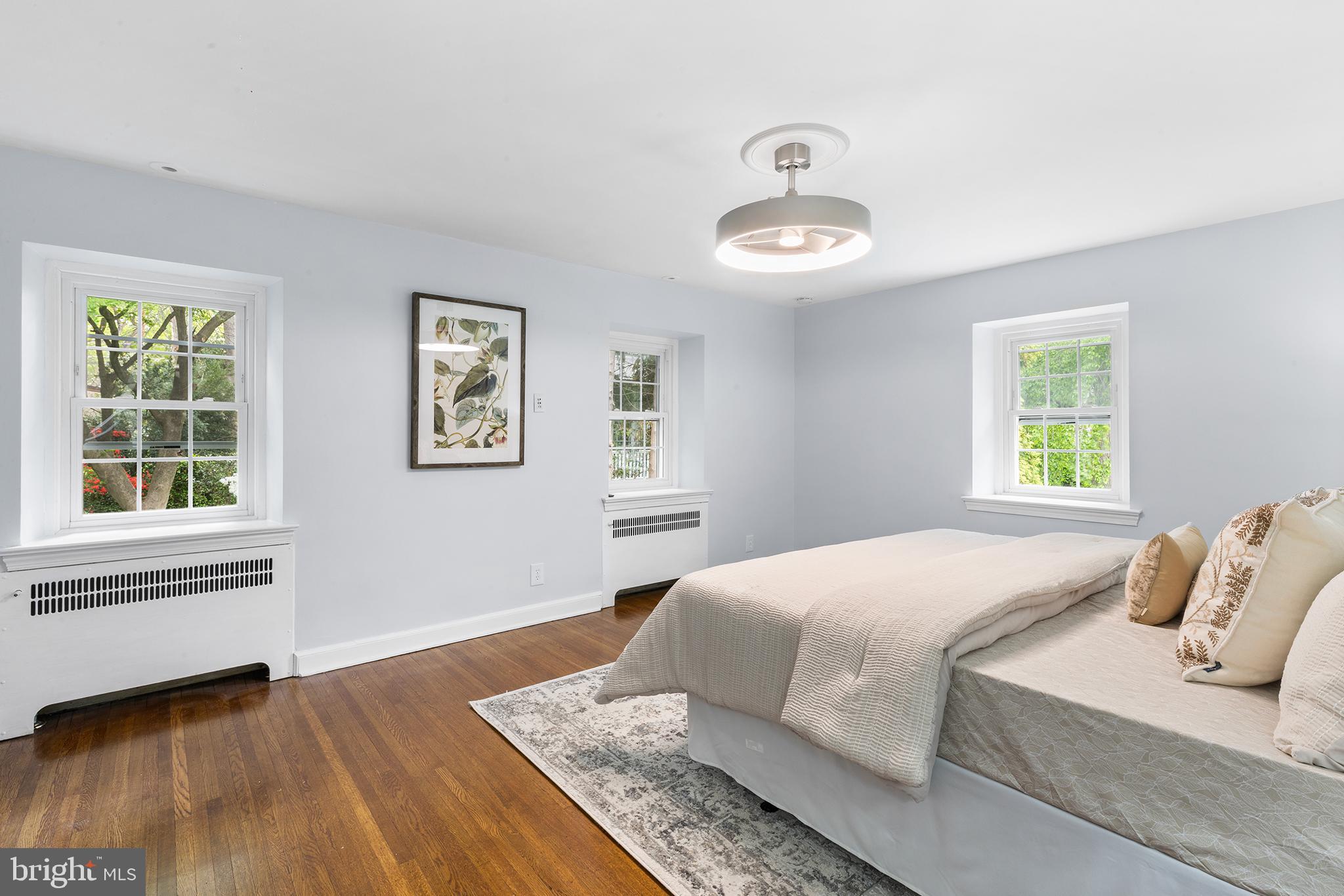 112 Rolling Road Bala Cynwyd, PA 19004 - Photo 19 of 39 a bedroom with a large bed and a window