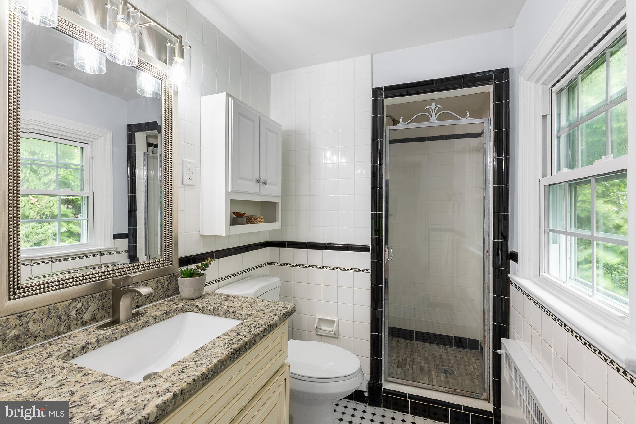 112 Rolling Road Bala Cynwyd, PA 19004 - Photo 20 of 39 a bathroom with a granite countertop sink toilet and shower