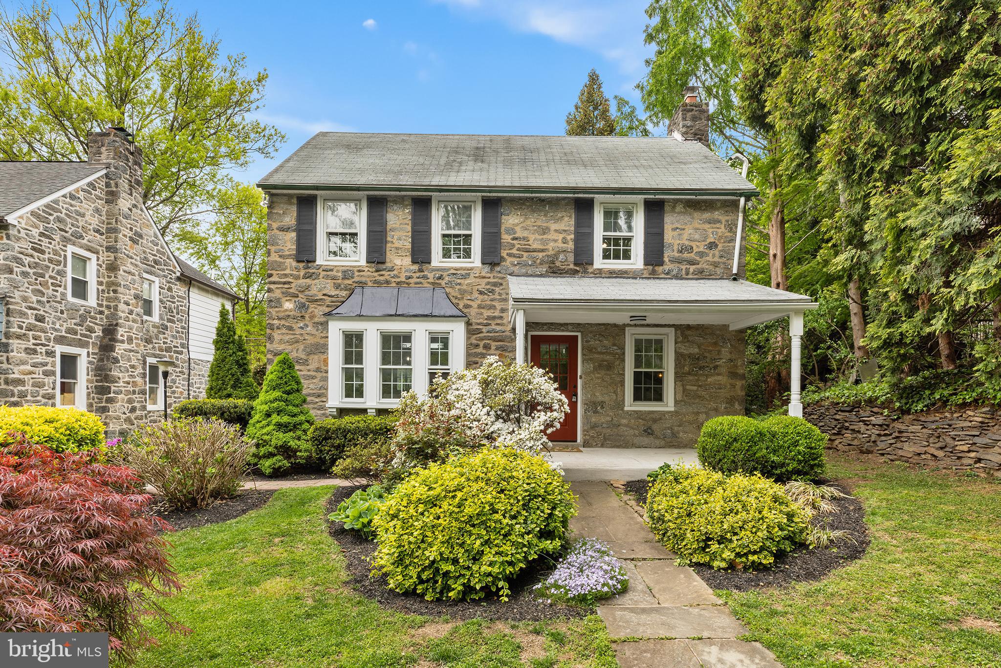 112 Rolling Road Bala Cynwyd, PA 19004 - Photo 2 of 39 a front view of a house with garden