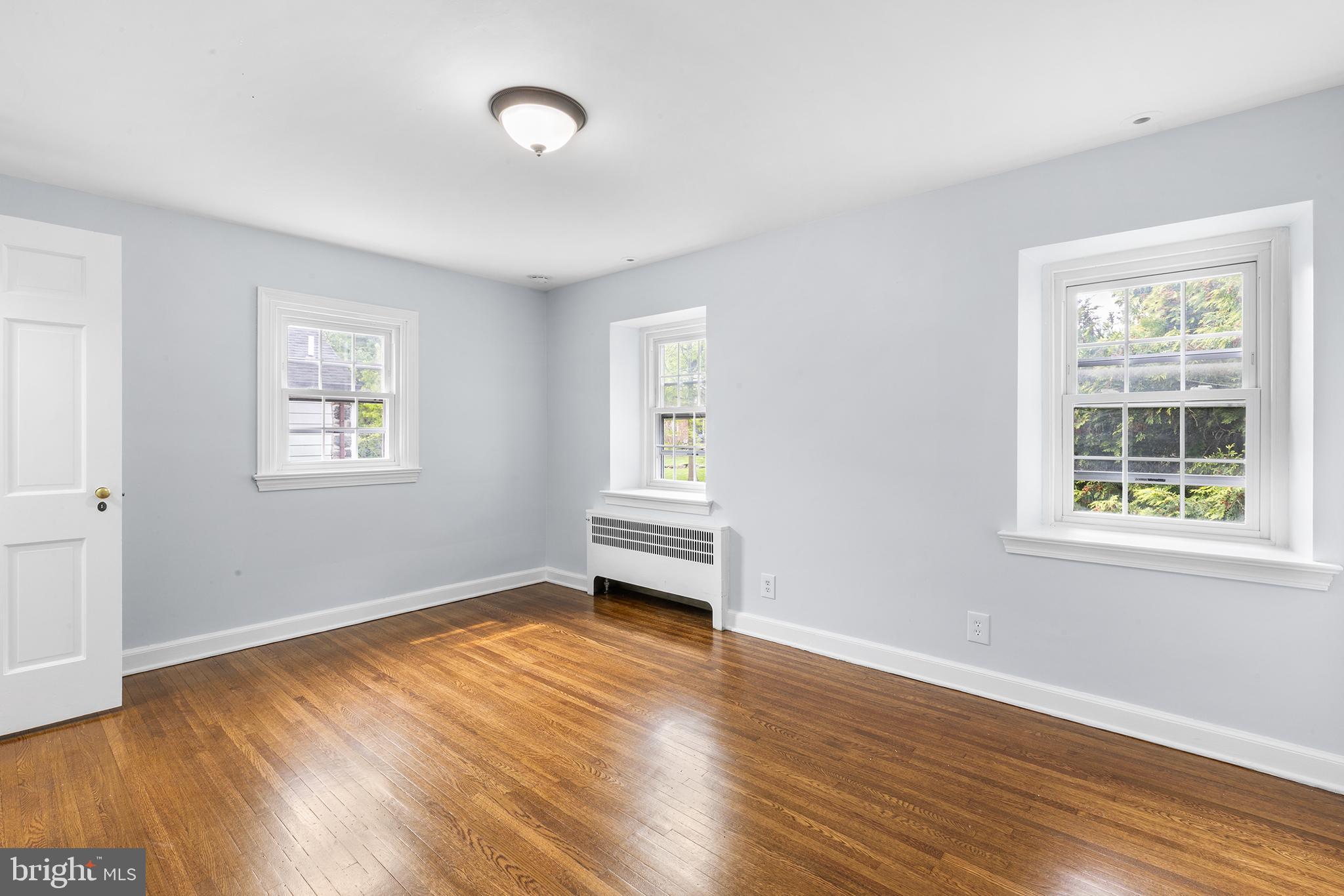 112 Rolling Road Bala Cynwyd, PA 19004 - Photo 25 of 39 a view of empty room with wooden floor and fan
