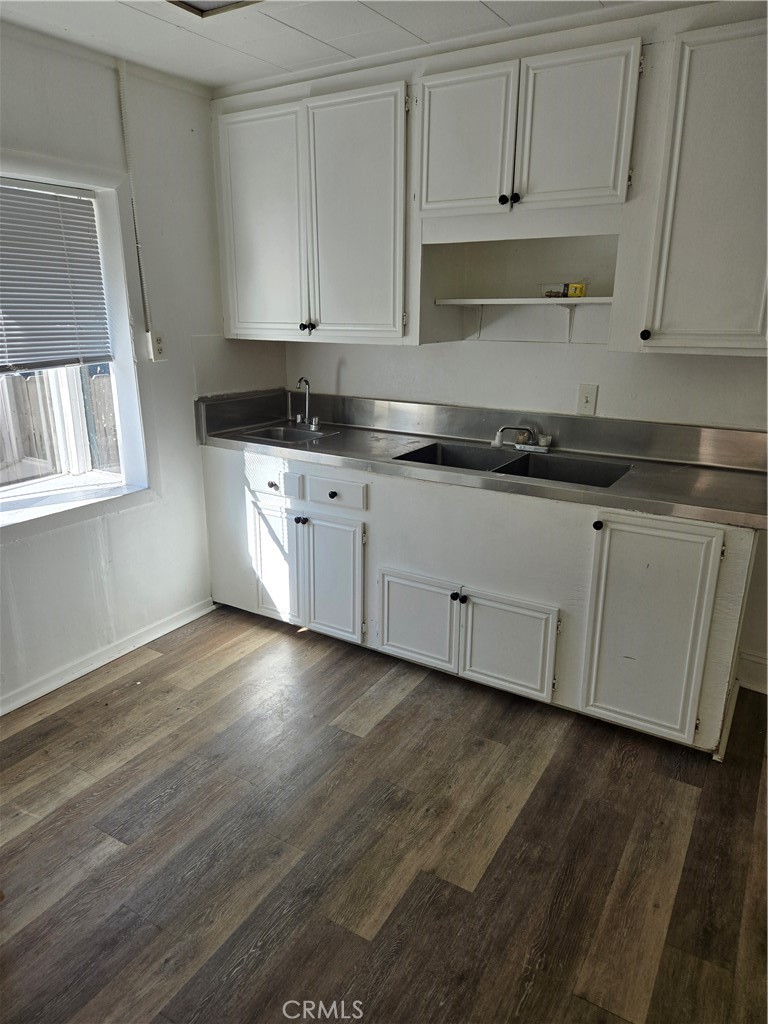 353 Highway 138 Crestline, CA 92325 - Photo 4 of 12 a kitchen with granite countertop white cabinets and a stove